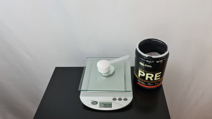 Optimum Nutrition Gold Standard Pre Advanced Single Serve on Scale Next to the Product
