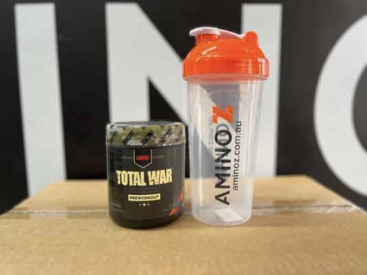 Redcon 1 Total War Pre Workout Front of product next to Amino Z shaker (with product in it)